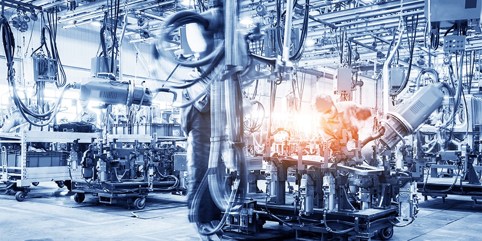 robots welding in a car factory